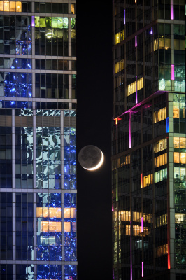 New moon among skyscrapers